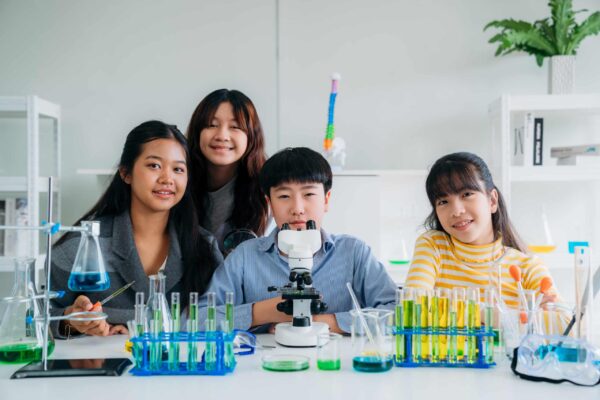 Group of Primary class children engaged in hands-on scientific experiments. Students discovering the wonders of science through interactive and engaging experiments. Group of Primary class children engaged in hands-on scientific experiments. Students discovering the wonders of science through interactive and engaging experiments.