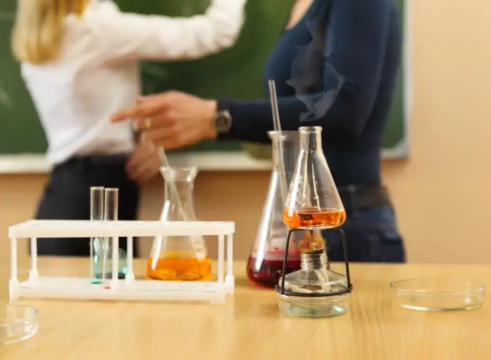Chemistry laboratory glassware with liquid formula at the classroom